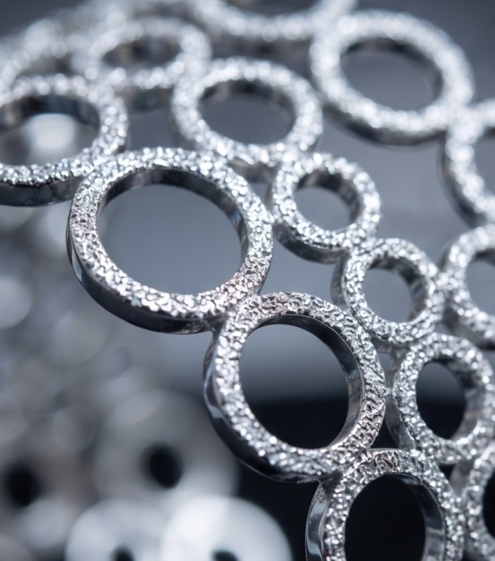Dolce Vita - Precious Natural 12.5 carat pave White Topaz rhodium over .925 Sterling Silver handcrafted bracelet - Close-up of textured silver rings with pave White Topaz detailing.