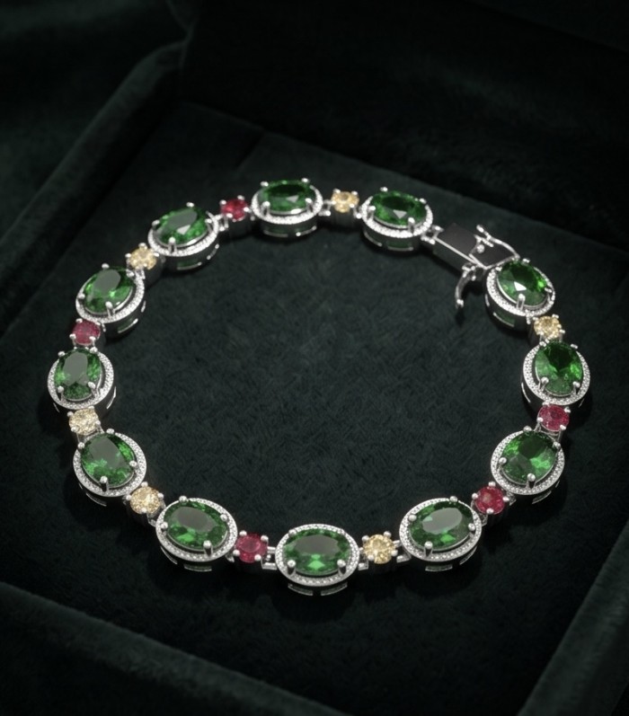 Authentic 17.9 carat Chrome Diopside .925 Sterling Silver handcrafted Bracelet - Chrome diopside silver bracelet on dark green background, top view.