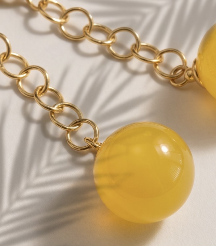 Very Special product - Wonderful Butterscotch Baltic Amber .925 Sterling Silver DIPPED IN 18k Gold entirely handcrafted earrings - Close-up of gold chain with butterscotch amber bead.