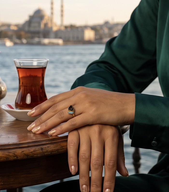 Red Heart 4.1 carat natural Garnet 18K Gold over .925 Sterling Silver Handcrafted Ring size 8 - Ring worn on hand with a tea glass in the background