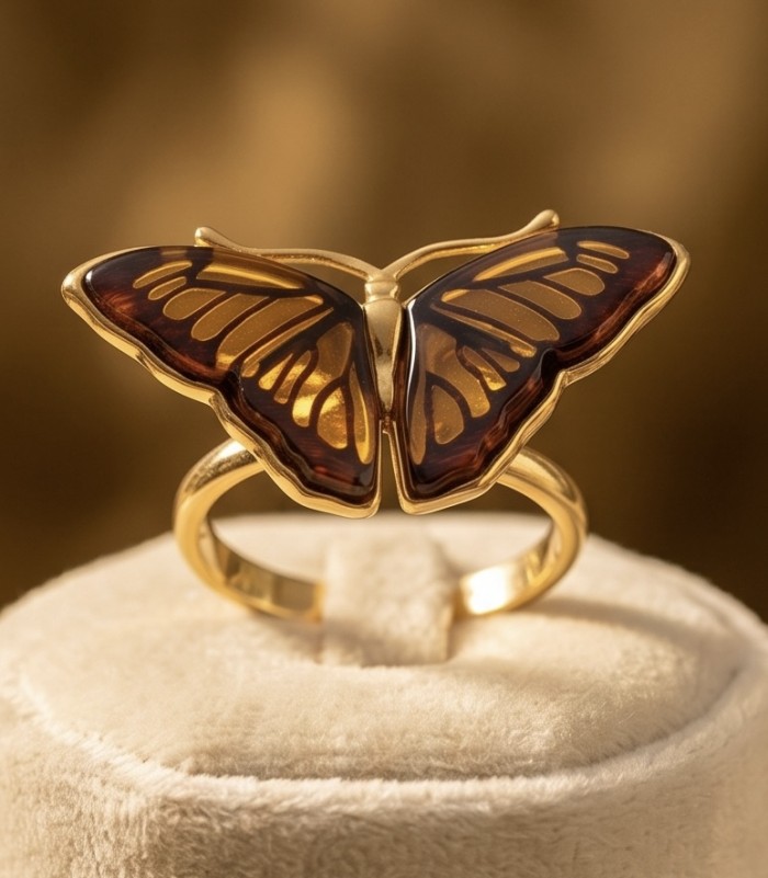 Butterfly Authentic Baltic Amber .925 Sterling Silver dipped in 18K Gold handcrafted ring; s. 7 adjustable - Butterfly-shaped amber ring close-up on display stand