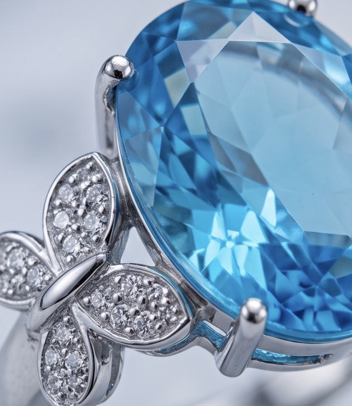 Oceania 14.5 carat Paraiba Tourmaline .925 Sterling Silver Handcrafted Ring size 8 3/4 - Close-up of Paraiba Tourmaline ring with butterfly detail in silver.