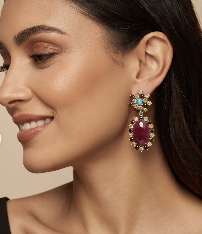 Real Art - Giovanna Natural 20.2 carat Kasmir Ruby .925 Sterling Silver handcrafted Statement earrings - Elegant side view of colorful gemstone earring worn on ear.