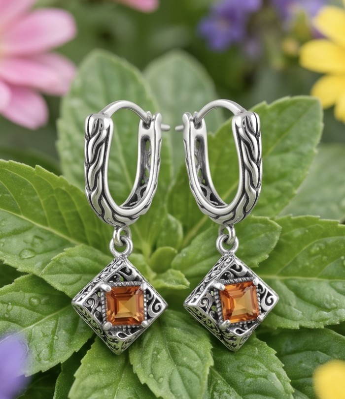 Valentina 2.5 carat Padparadscha Orange Sapphire .925 Sterling Silver handcrafted earrings - Padparadscha Sapphire Earrings front view with floral background