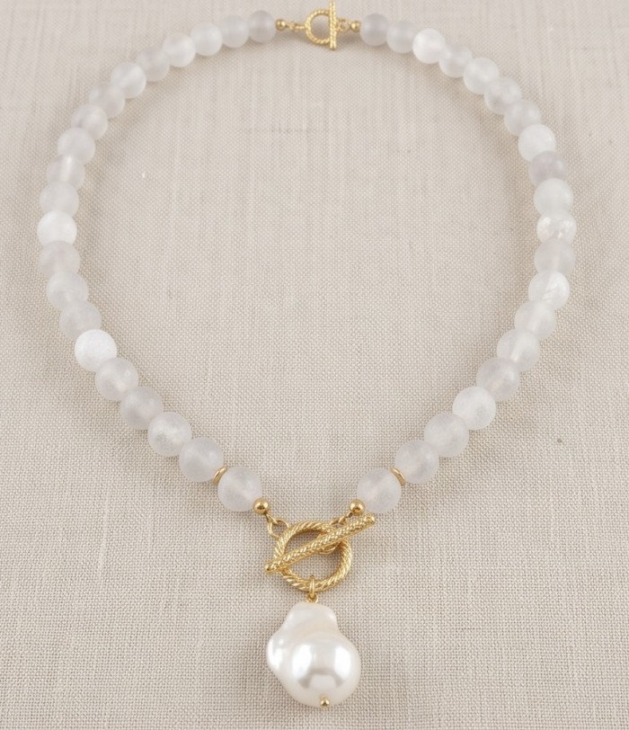 Strawberry - Rose Quartz 14K Rose Gold over .925 Sterling Silver .925 Sterling Silver Necklace - Necklace with rose quartz beads and a pearl pendant on fabric background.