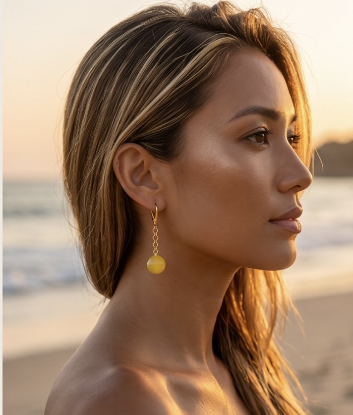 Very Special product - Wonderful Butterscotch Baltic Amber .925 Sterling Silver DIPPED IN 18k Gold entirely handcrafted earrings - Side view of woman wearing Wonderful Butterscotch Baltic Amb earrings.