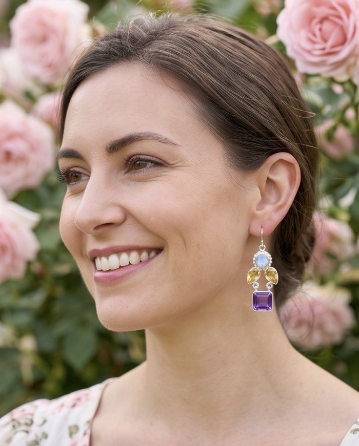 Fiesta Authentic 16.5 carat Multigem .925 Sterling Silver dipped in Rhodium handcrafted earrings - Side view of Fiesta multigem earrings worn in front of pink roses.