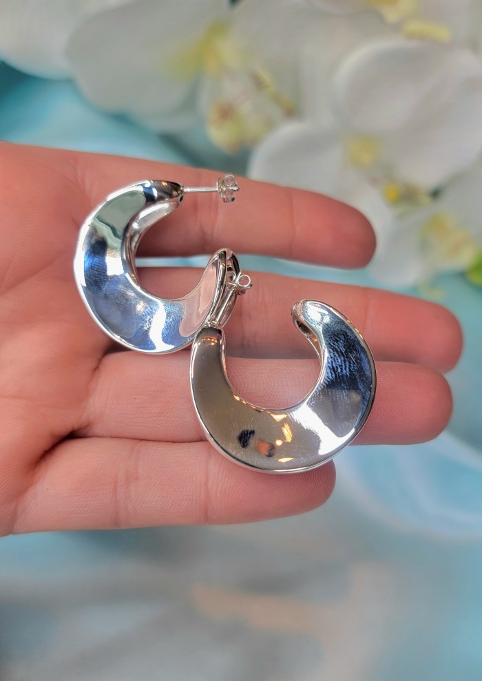 LARGE - EXTRAVAGANZA - Highly Polished Fancy .925 Sterling Silver Italy made Earrings - Hand holding large polished crescent silver earrings, front view.